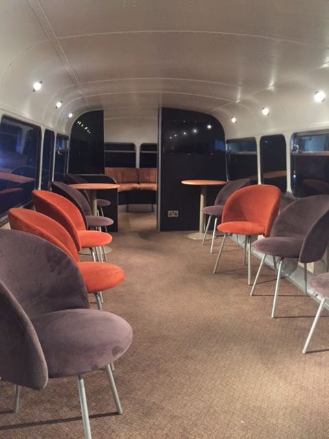 brown and orange seating static bus hire