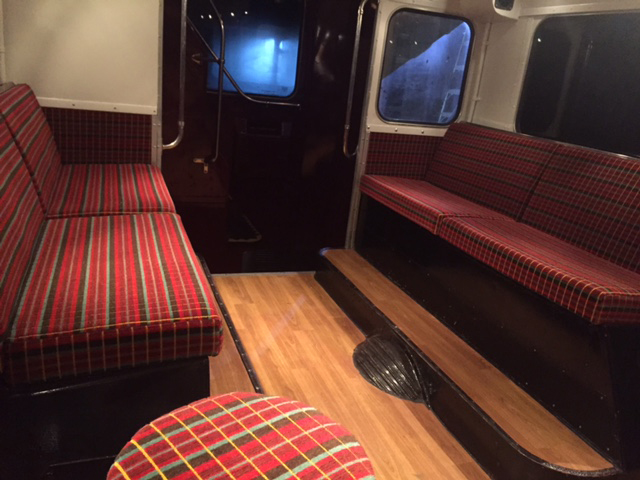 patterned seats with wooden floor static bus hire